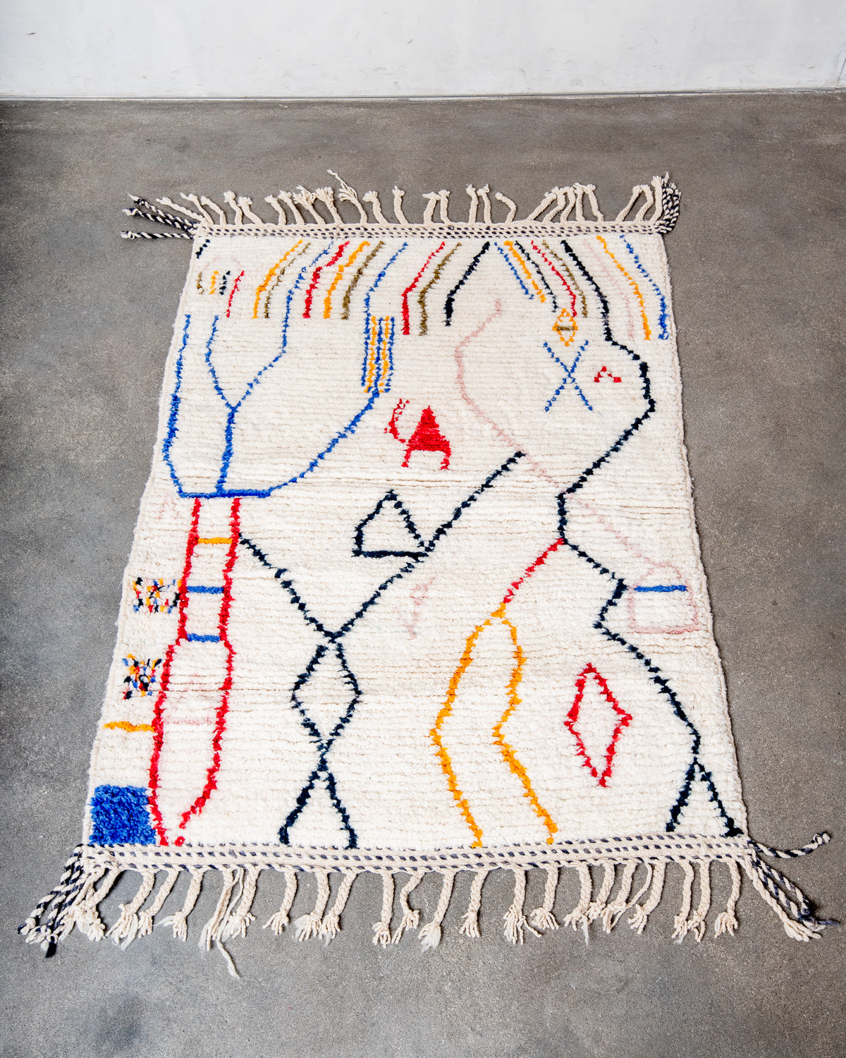 Modern, designer, handcrafted Berber rug from Morocco. Beniourain carpet with beautiful colours and patterns and fluffy wool texture.